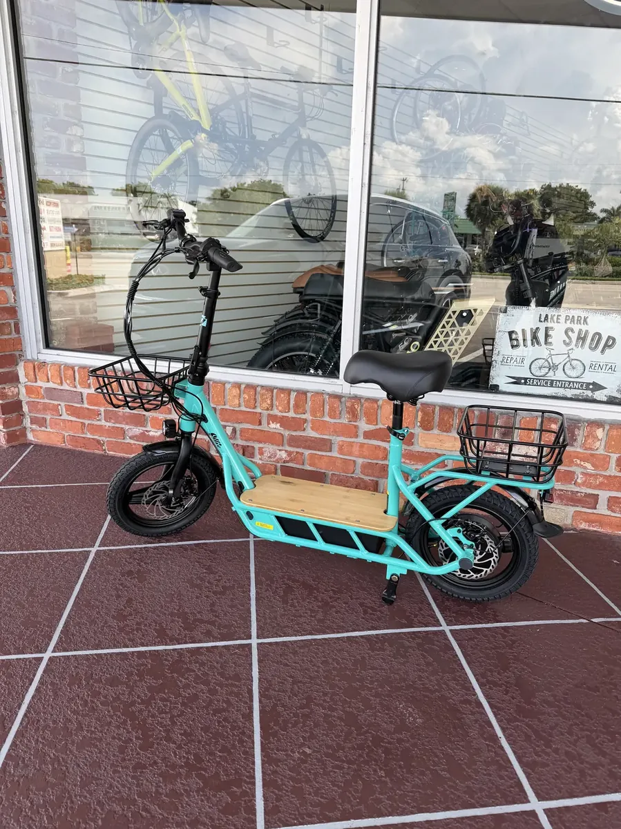 View photo 5 of Electric scooter outside the shop window